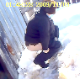 An outdoor security camera in Russia captures a female employee at a factory shitting out in the stock yard. Little nuggets of shit can be seen falling into the snow. Over 1.5 minutes.